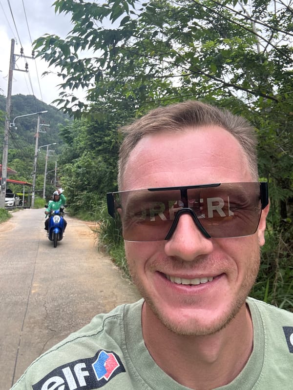 A roadside pause in Rawai with cars, palms, and selfies