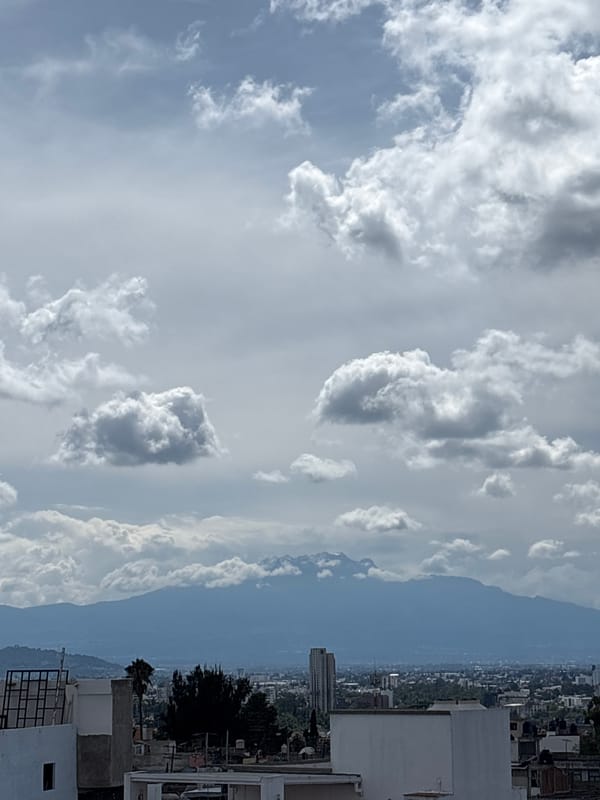 Evening in Puebla, city views and volcano on the horizon