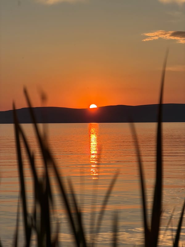 Sunset from a Russian shoreline, golden hour on the water