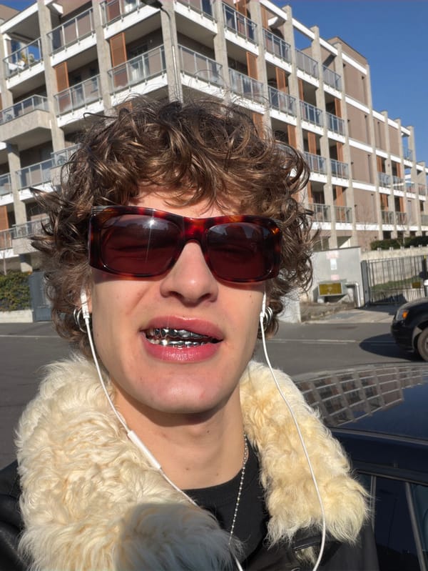 Young man spotted in sunny Milan wearing tortoiseshell sunglasses