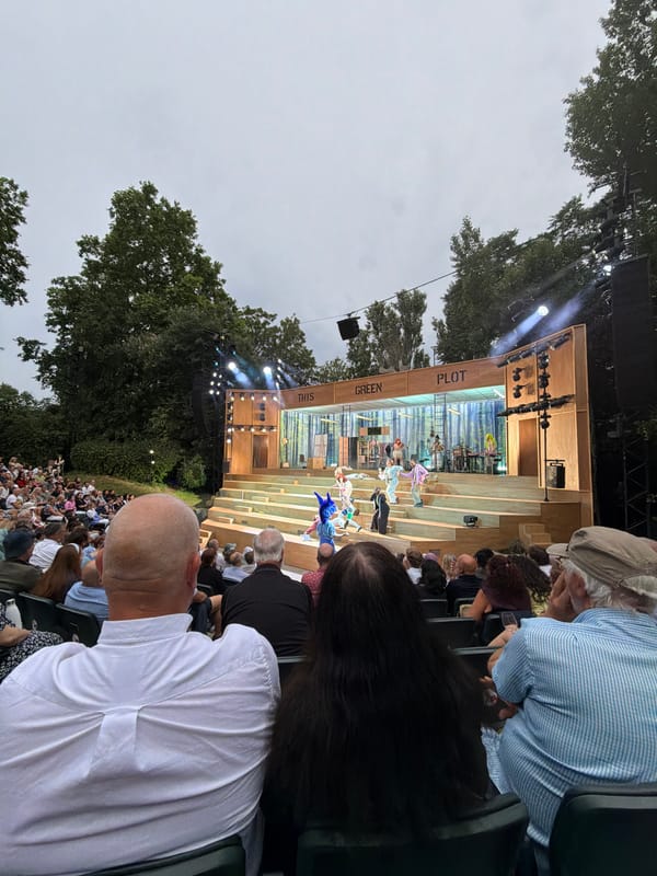 Outdoor theater performance on a cloudy London evening