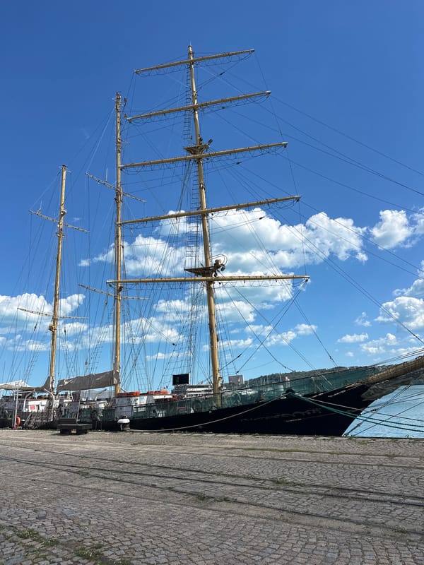 Luxury vehicles spotted near historic sailing ship in Varna harbor