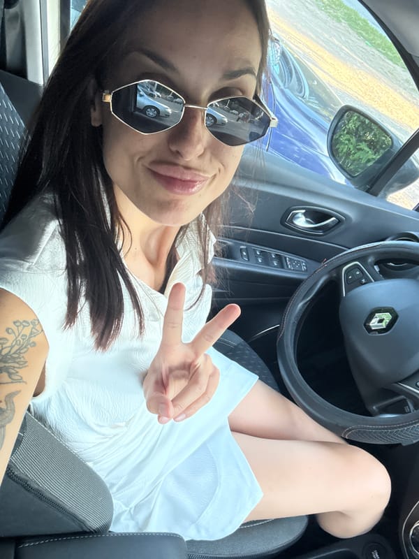 Quick stop in Pleven: peace signs, selfies, and a pink rose.