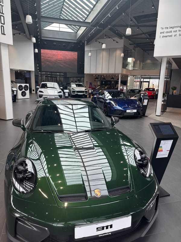 Green Porsche 911 displayed at Bulgaria dealership showroom