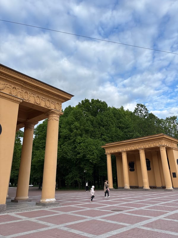 Yellow-columned buildings photographed in Saint Petersburg architectural complex