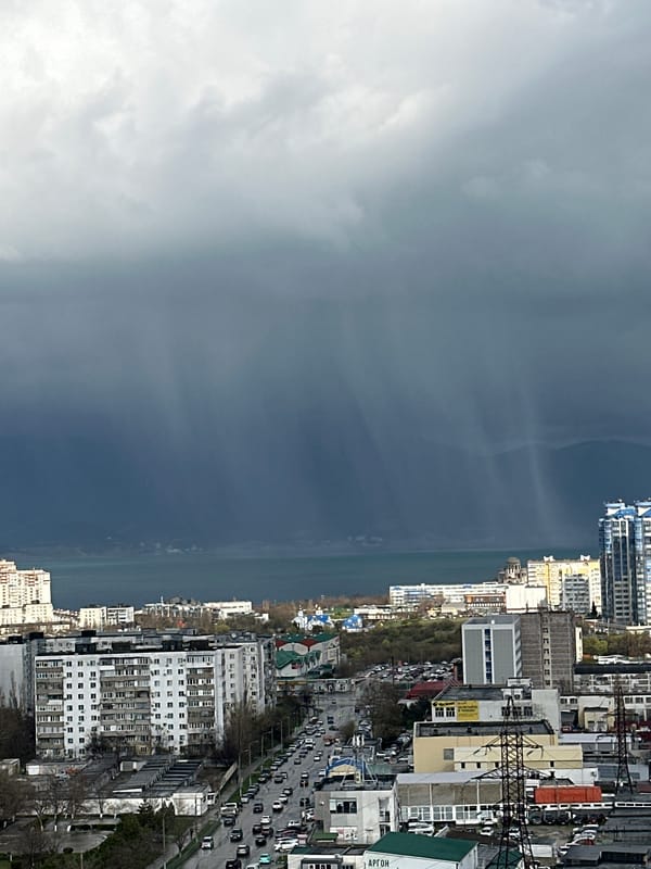 Cloudy coastal cityscape captured by unknown witness