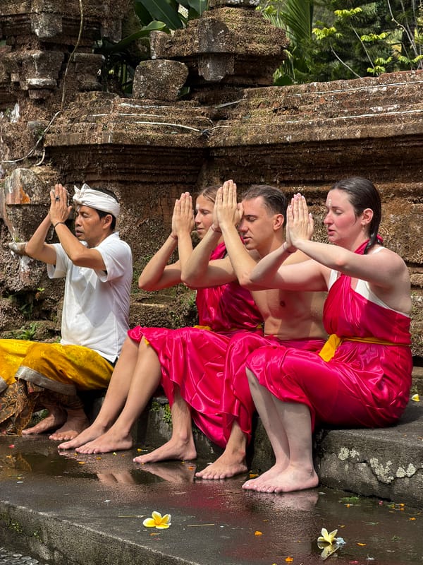 Prayer and offerings at a moss-covered Tegallalang temple