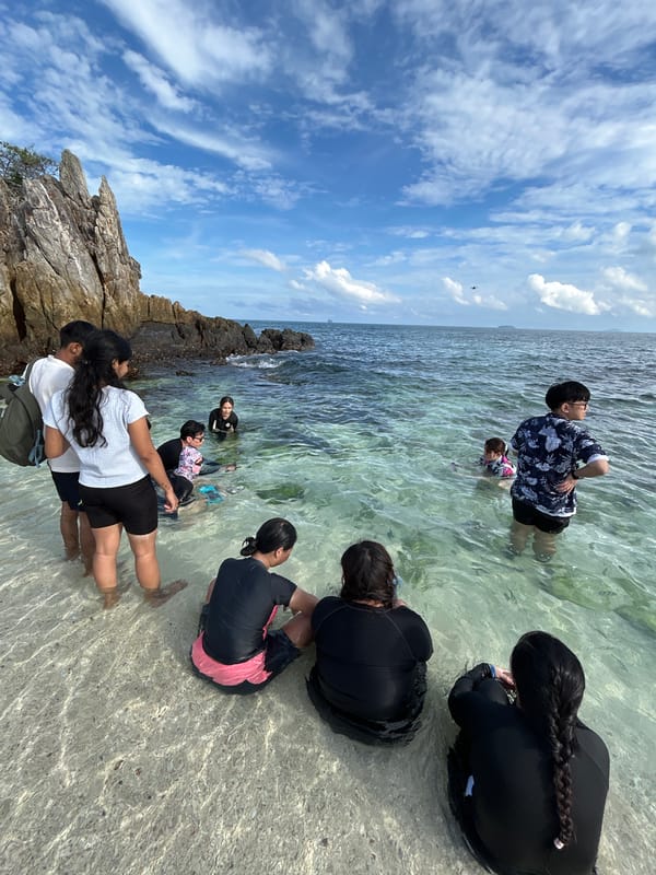 Family group enjoys morning at Phru Nai beach cove