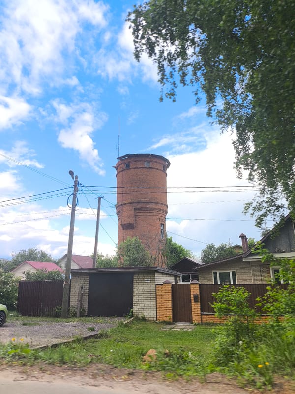 Unknown witness documents rural journey with Soviet symbols, spring blooms