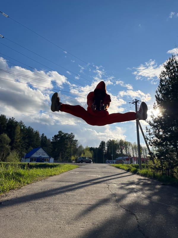Person in Orange Explores Chaikovsky Russia During Afternoon Walk