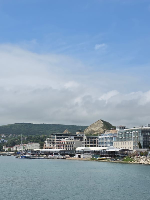 Tourist documents morning walkabout in coastal Balchik, Bulgaria