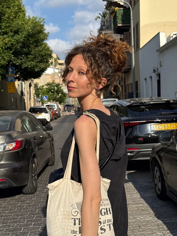 Afternoon stroll through a Tel Aviv street with a canvas tote