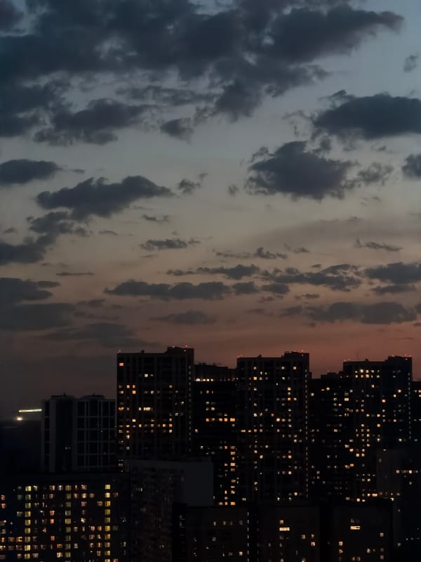 Evening lights illuminate Khimki apartment buildings at dusk