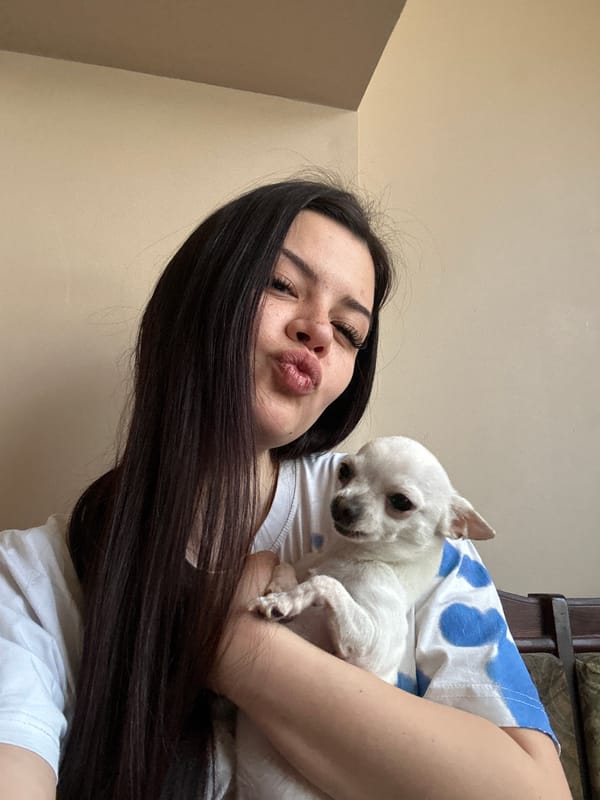 Woman and Chihuahua pose for selfies in Sliven