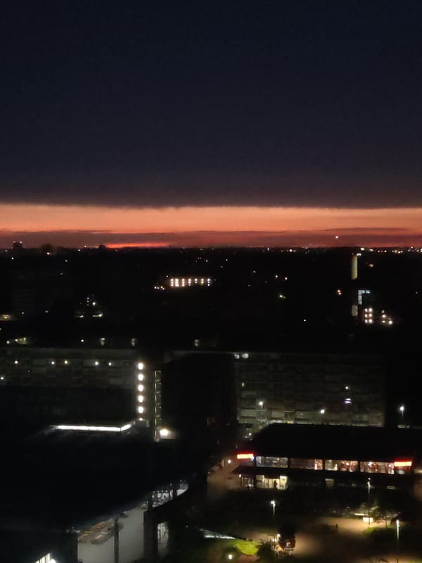 Late-night aerial views over Rijswijk with a glowing horizon
