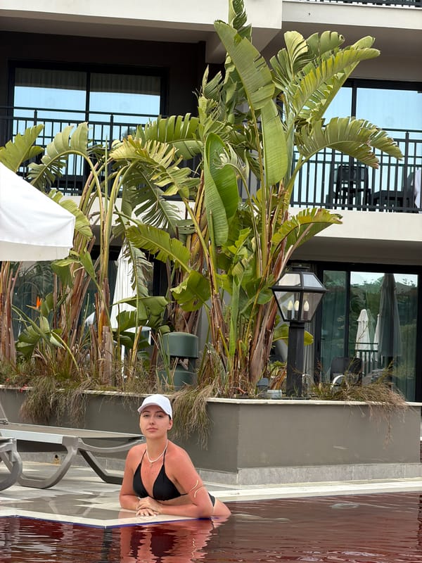 Woman enjoys poolside afternoon at Turkish resort in Serik