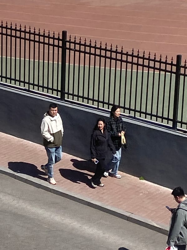 Early morning gathering near athletic facilities in China