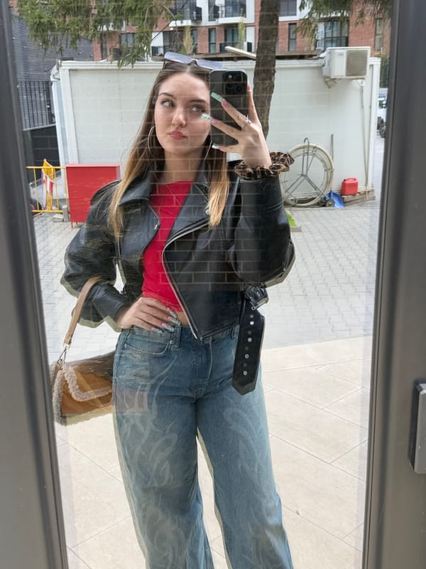 Two women captured in mirror reflection in Sofia