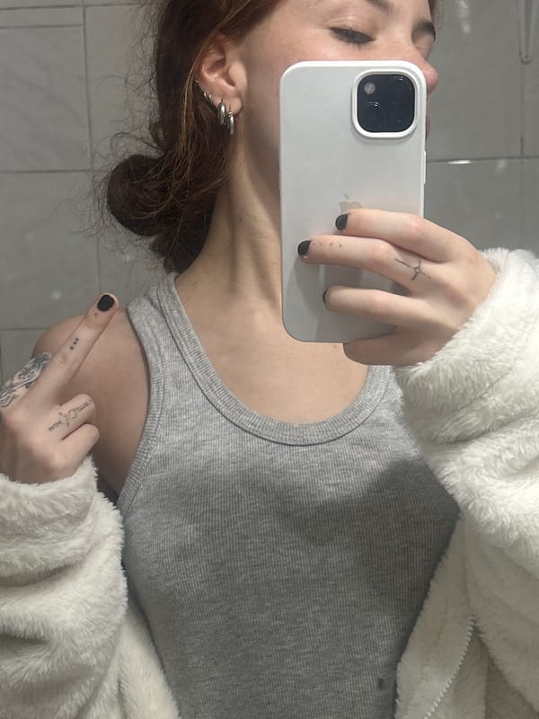 Late-night selfie captured against tiled wall in Buenos Aires