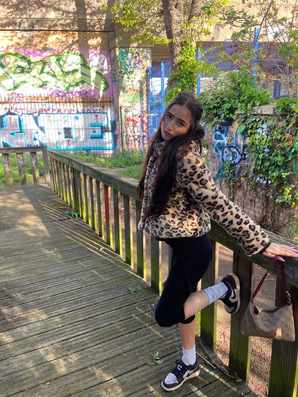 Woman poses for photos on London walkway