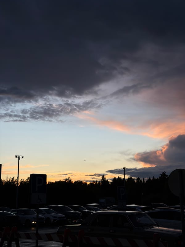 Evening scenes documented across Izhevsk parking areas, dramatic clouds