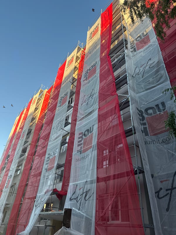Urban afternoon: rides, streets, and scaffolding in an Eastern European city