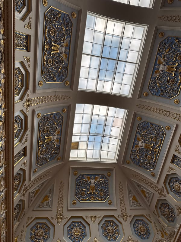 Gilded ceilings and ornate bas-relief in a grand historic interior