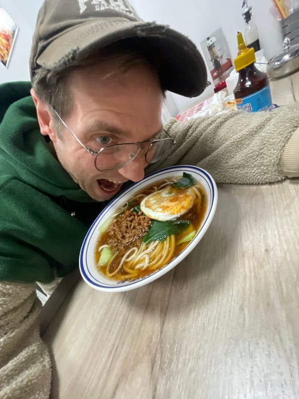 Person enjoys ramen lunch in Belgrade restaurant