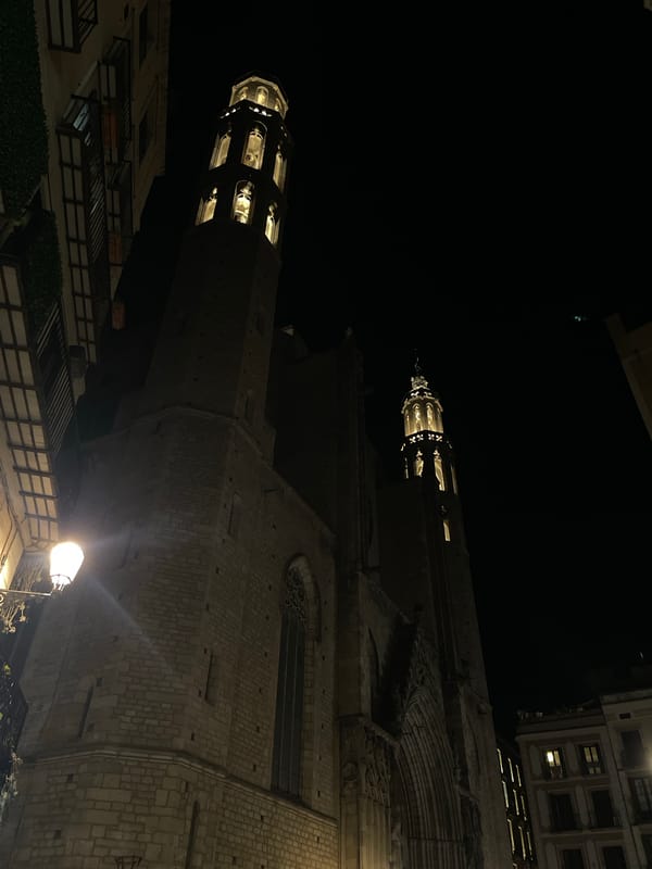Evening scene around a cathedral with a live event nearby