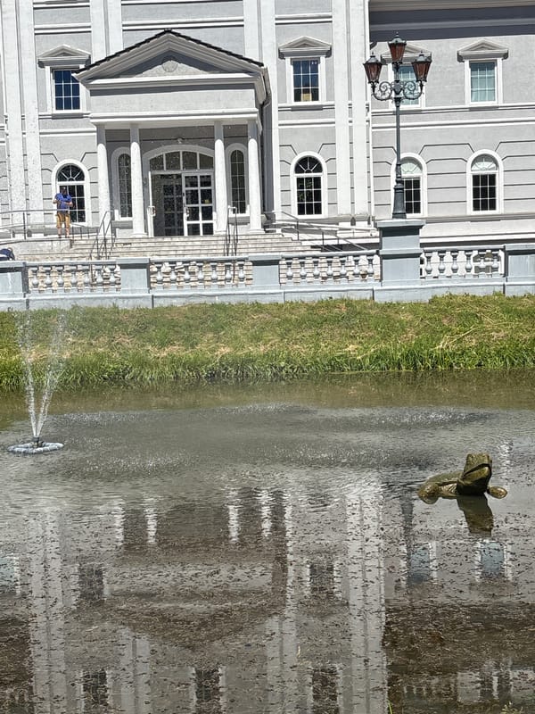 Classical building with pond and bronze frog, Kaliningrad