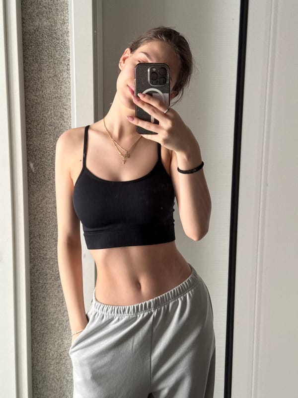 Woman takes morning mirror selfies in Sofia apartment