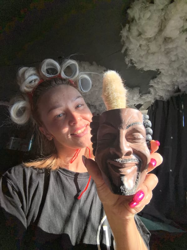 Woman poses with disco ball, novelty planter in early morning
