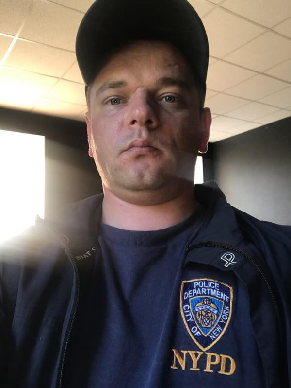 NYPD-shirted man photographed amid spring blooms in Kherson