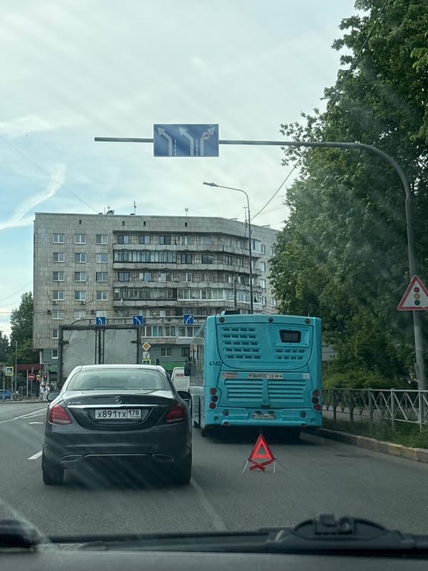 Vehicle occupant documents overcast street scene in Saint Petersburg