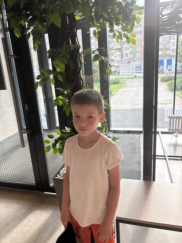 Boy in baseball cap observed across Izhevsk locations