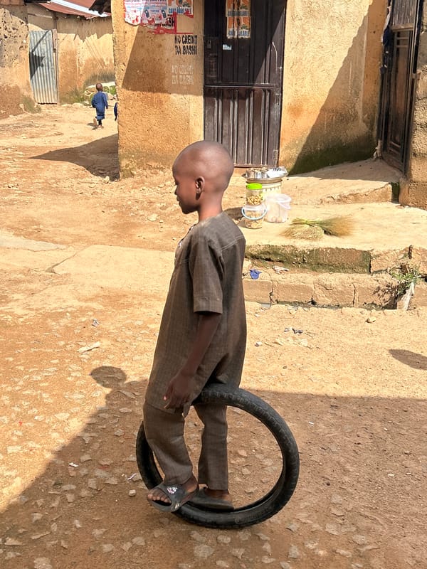 Midday street life across Jos, Nigeria's busy market district