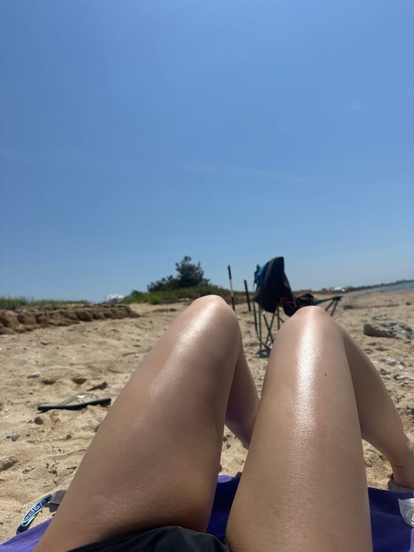 Beachgoer documents sunny relaxation session at Ofrynio Beach, Greece