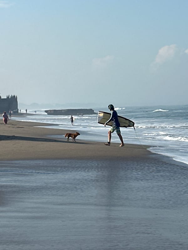 Early morning beach activity captured in North Kuta, Indonesia