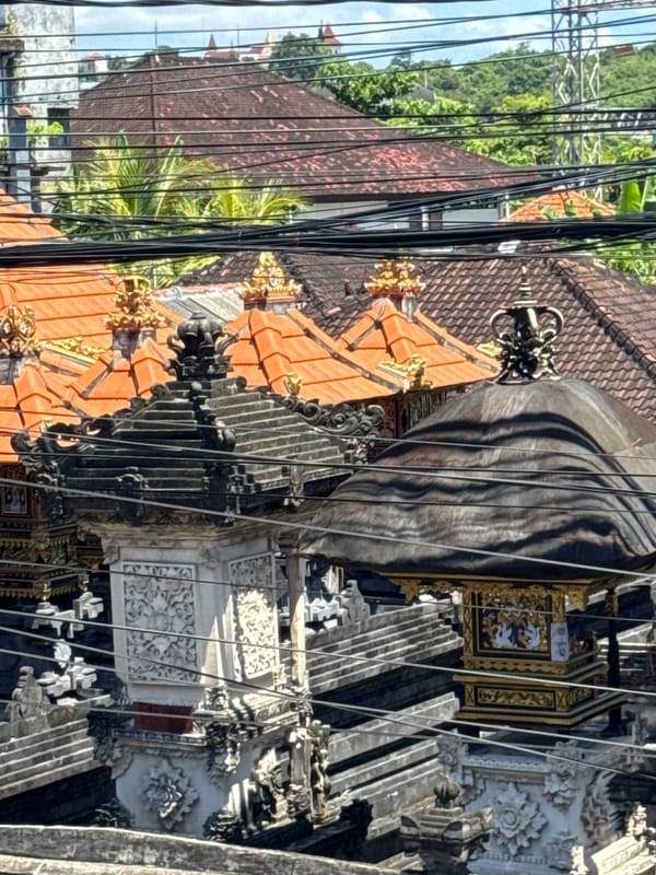 Traditional temple and modern construction photographed in Indonesia