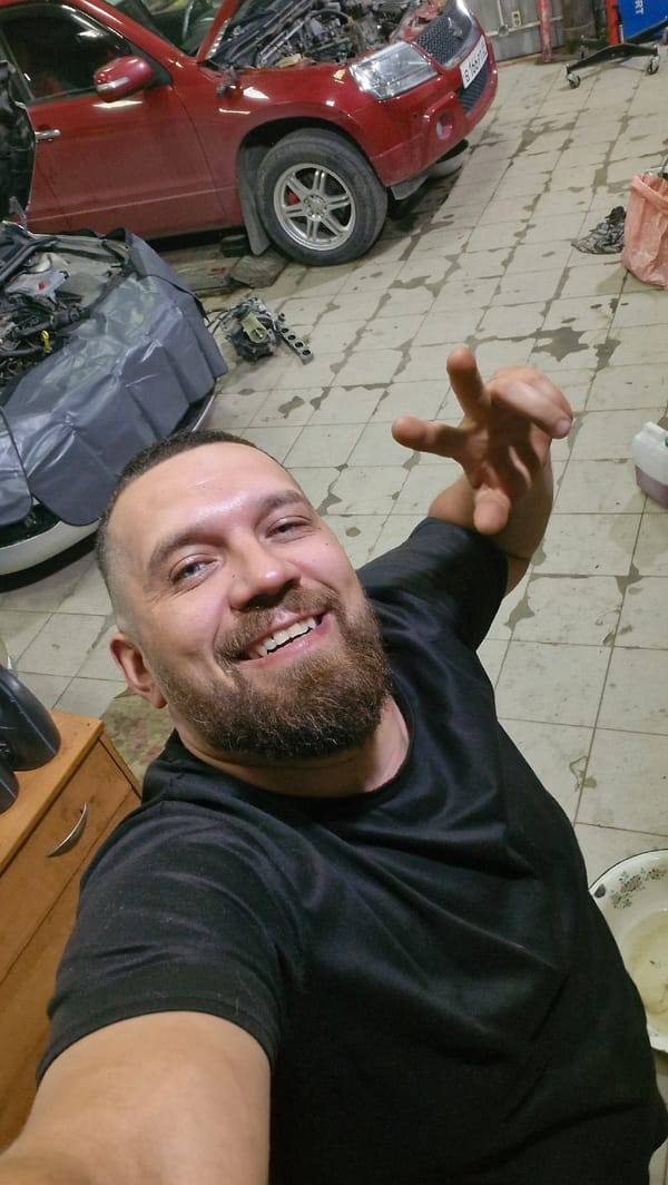 Hanging out in a Salekhard garage with a red SUV