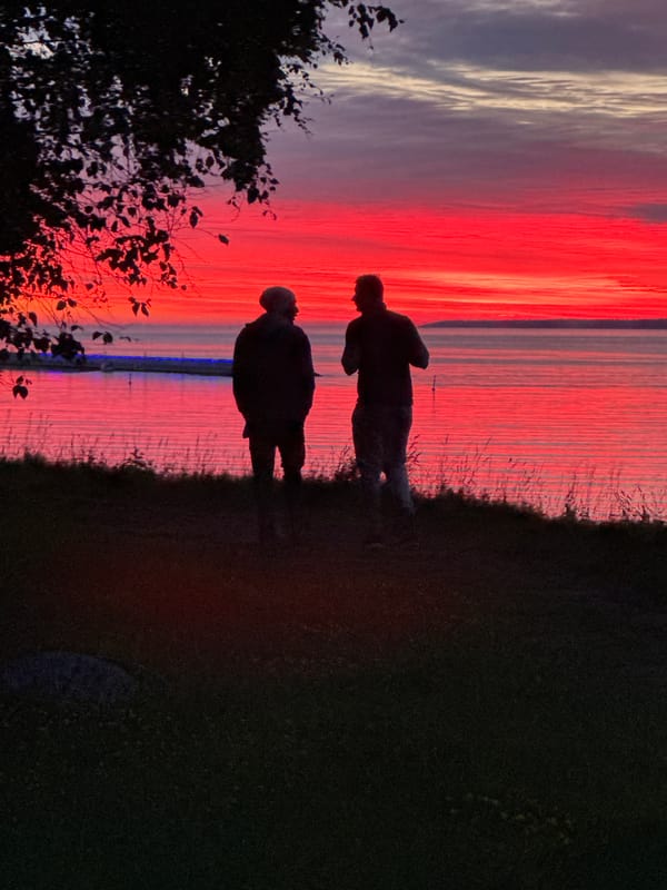 Dramatic Baltic Sea sunset draws evening walkers in Tallinn