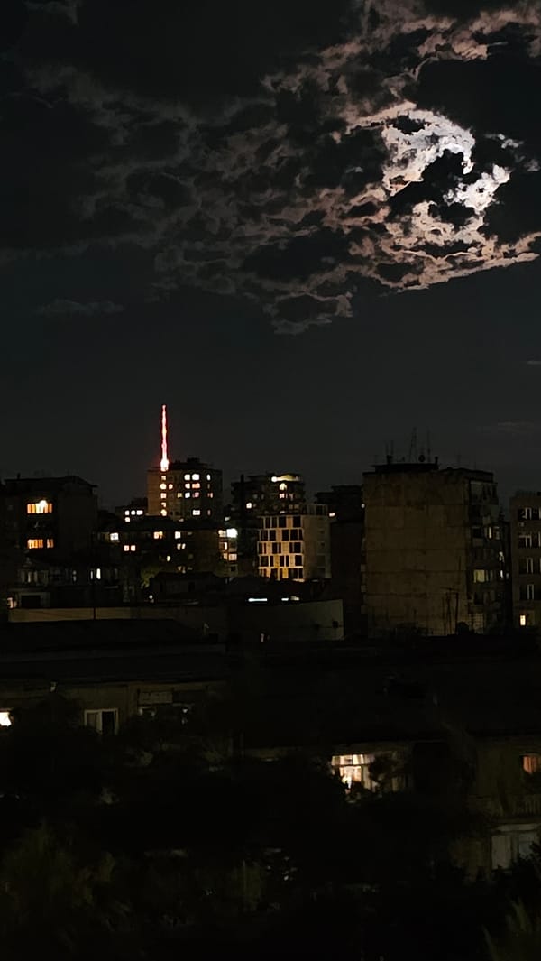 Full moon rises over Yerevan on a cloudy night