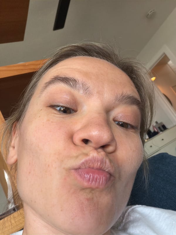 Person takes puckered-lip selfie indoors in Solana Beach