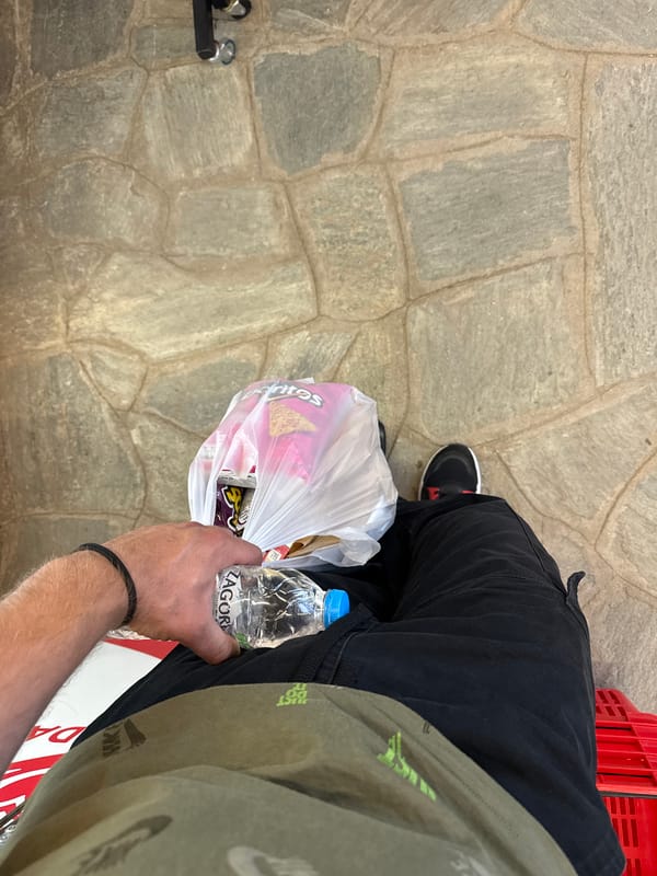 Sitting outside a convenience store in Sithonia, Greece