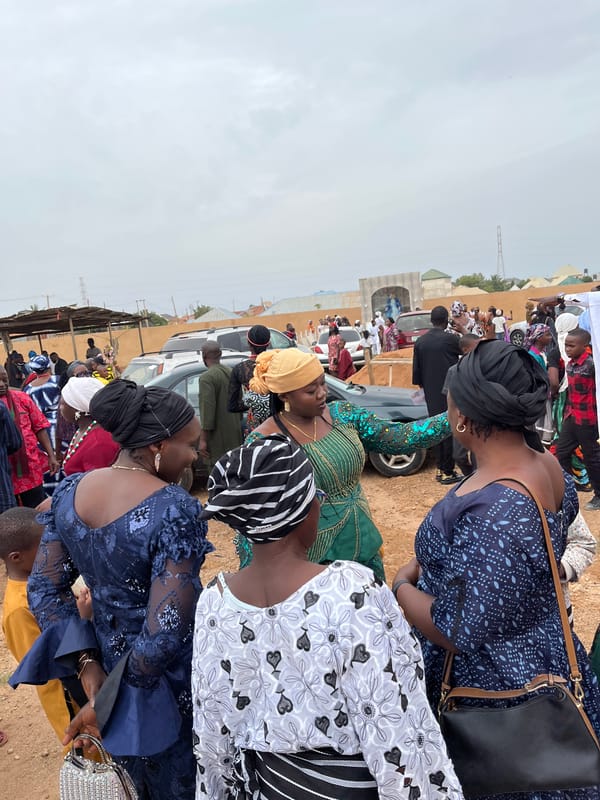 Women in traditional dress gather in Jos, Nigeria