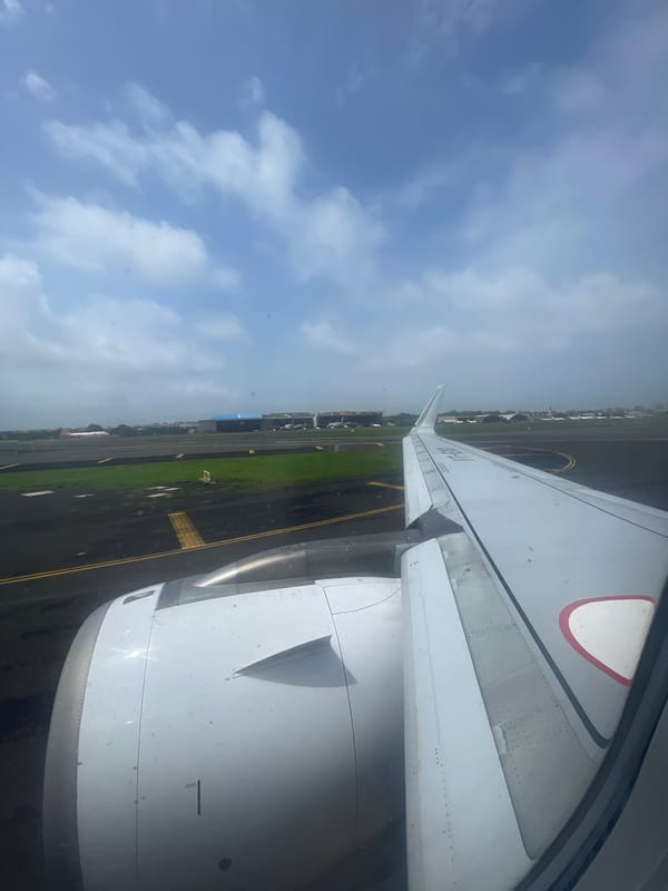 On the ground at Mumbai airport, wet runway, waiting to move
