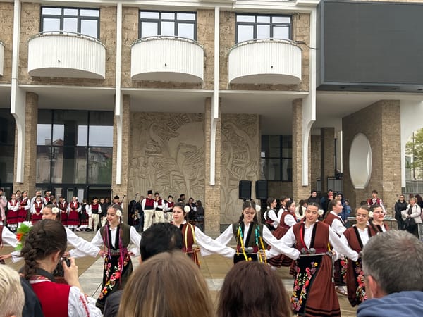 Folk dancers perform in Blagoevgrad streets under cloudy skies