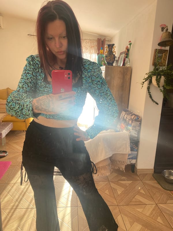 Woman takes mirror selfies at home in Kunje, Montenegro