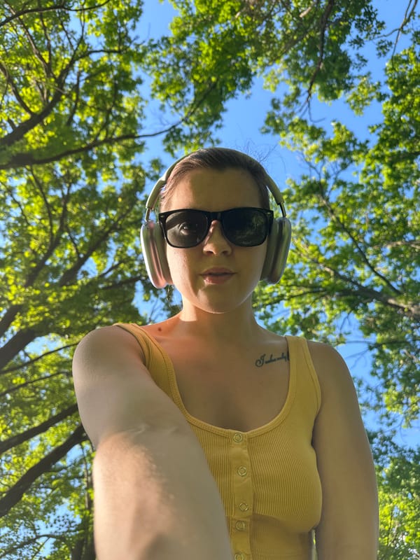 Person in yellow photographed on forest path in Vladimir