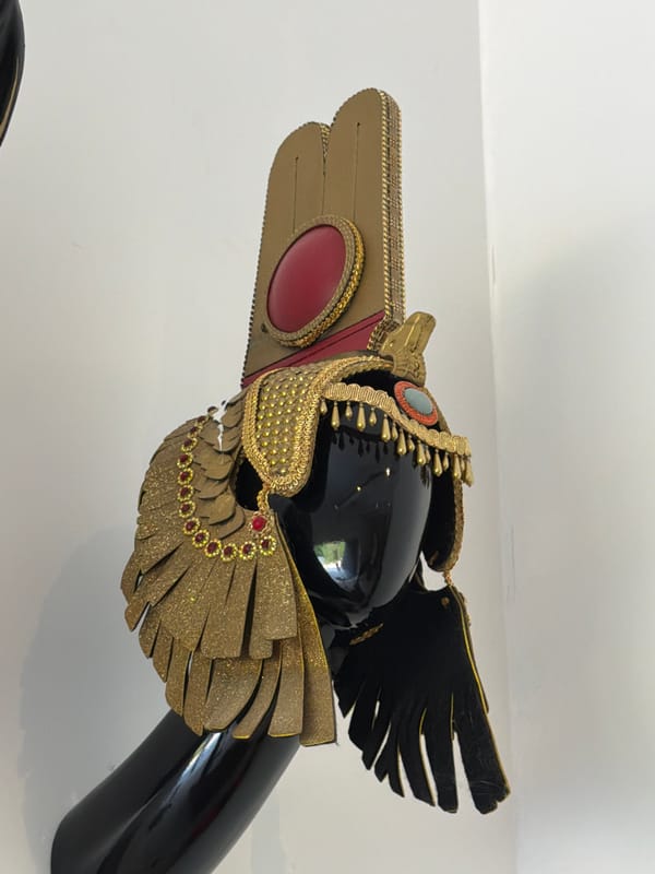 Ornate Egyptian-themed costumes and masks on display in Ko Samui